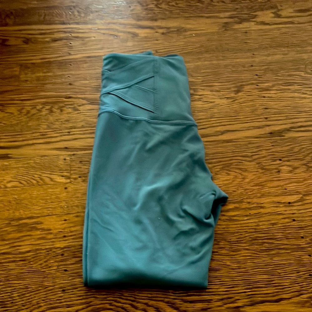 blue leggings with design on bottom of pants and waistband
